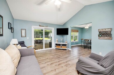 Living room has beautiful vaulted ceiling