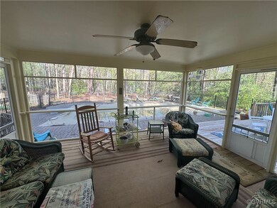Sunroom / solarium with ceiling fan and a wealth of natural light