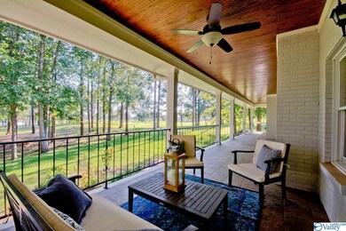 Gorgeous covered porch with stunning beadboard ceiling. Spectacular lake views and of the 6th hole of the Robert Trent Jones Golf Course!