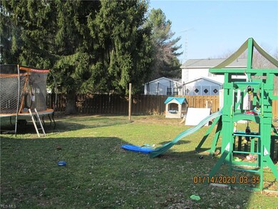 Another view of fenced back yard