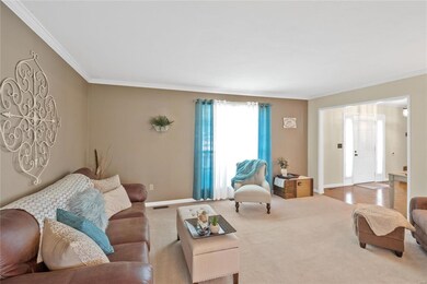 Large entry foyer & crown molding in formal living