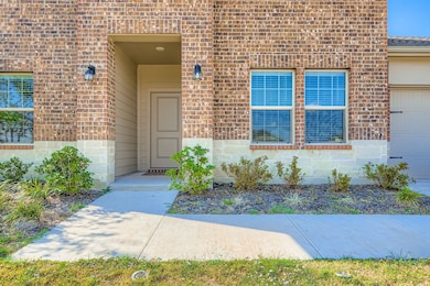 Property entrance with brick siding