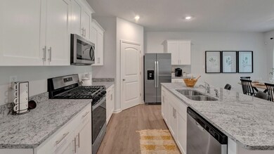 Kitchen featuring light hardwood / wood-style floo