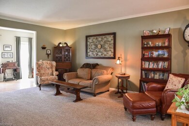 Spacious great room with crown molding.