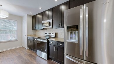 Large kitchen with plenty of cabinet/counter space and brand new SS appliances & LVP flooring.