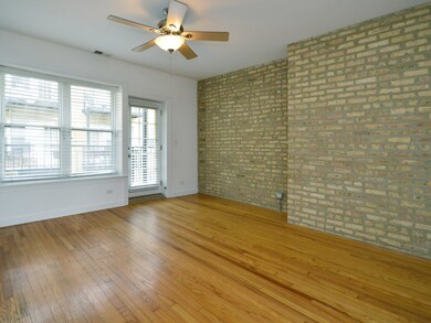 Gleaming Oak Hardwood Floors, Exposed Brick Throug