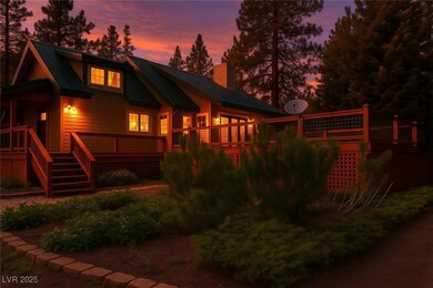 Back of house at dusk featuring a chimney, metal r