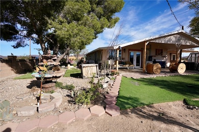 View of yard featuring a patio and french doors