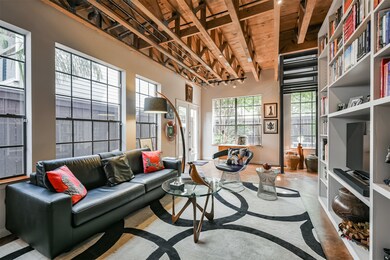 This first-floor bedroom boasts exposed ceilings,