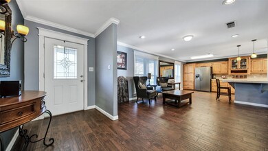 The foyers is light and bright and opens into the grand family room and formal dining room.