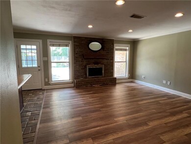 Wood burning fireplace with a gas starter.
