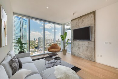 Living room with wood finished floors and floor t