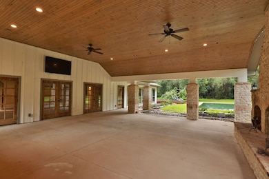 The summer kitchen features a grill, green egg, be