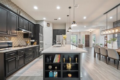 Kitchen with open shelves, appliances with stainl