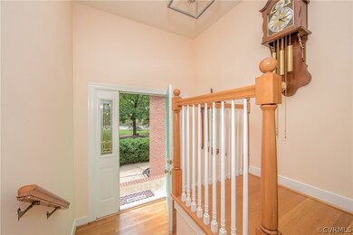 Inviting foyer with hardwood floors.