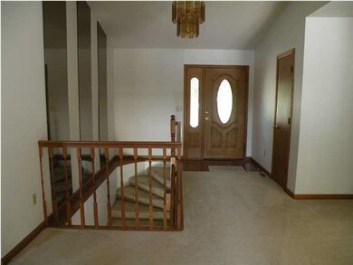 Curved staircase leading to basement