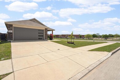 View of front of home featuring concrete driveway,