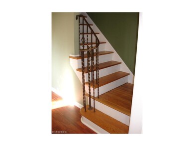 Refinished hardwood floors highlight the living/di
