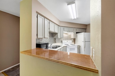 Breakfast bar looking into kitchen