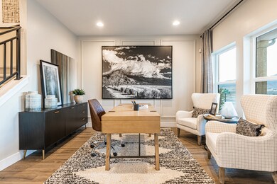 Office area featuring wood finished floors and recessed lighting