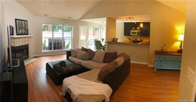 Bright and open family room has vaulted ceilings a