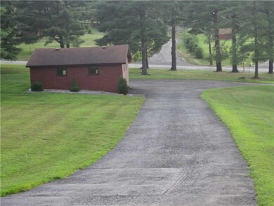 Exterior Front. Looking towards Red Cut Lodge Road