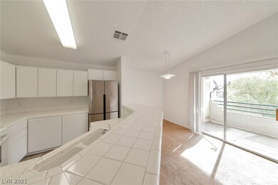View of Kitchen, Dining Area & Balcony that over l
