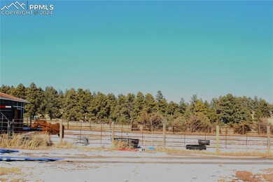 Side angle of horse stables.