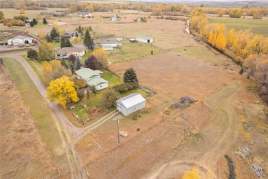 Aerial view of property and surrounding area featuring rural landscape