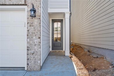 View of exterior entry featuring a garage