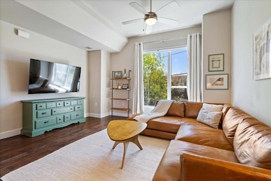 Living room featuring visible vents, baseboards, 