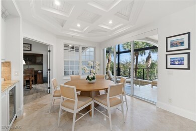 Dining space featuring coffered ceiling, baseboard