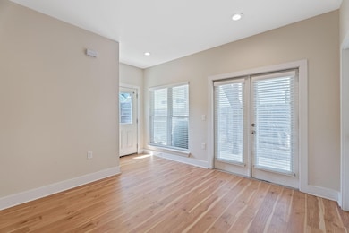 Unfurnished room with light wood-type flooring, b