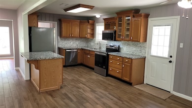 Open concept here- beautiful kitchen is centrally