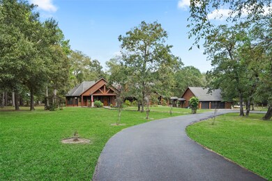 As you get closer to this magnificent home the exterior of the home is constructed of beautiful logs, showcasing the rustic charm and timeless elegance that log homes are known for past and present. *Grass has been photo enhanced