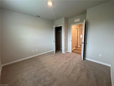 Unfurnished bedroom featuring carpet flooring and a closet