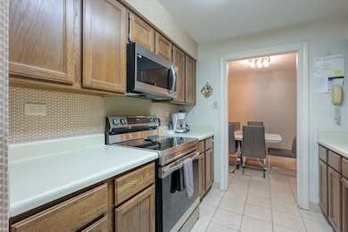 Fully equipped kitchen conveniently open to the dining room.