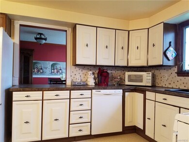 Loads of cupboards with newer dishwasher and tile 