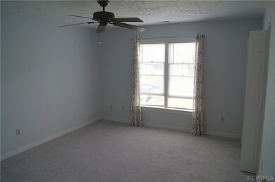 Primary bedroom with walk-in closet