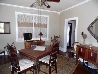 A lighted ceiling fan in the dining room is one of