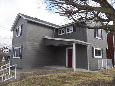 Side entrance with newly poured covered porch