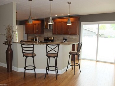 Kitchen has a breakfast bar.