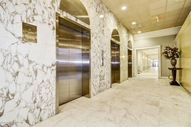 Elevators and Hallway to Amenities