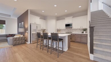 Kitchen featuring stainless steel appliances, bac