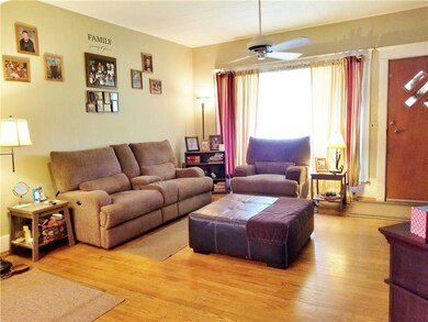 Living room with 9 foot ceilings and hardwood floo