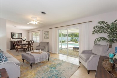 Living space overlooking backyard and pool