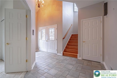 Two Story Tile Foyer