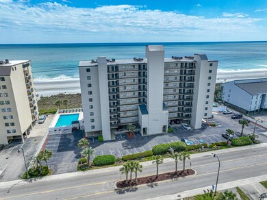 Birds eye view of property with a water view and a