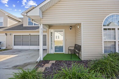 Doorway to property with driveway and roof with shingles