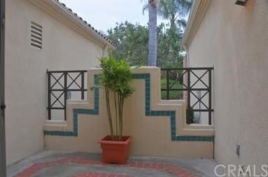 Private patio with slider outside kitchen nook. gr